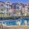 Resort-style swimming pool with lounge seating