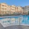 Resort-style swimming pool with lounge seating